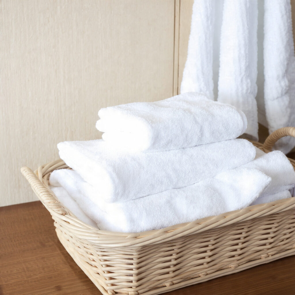 fresh towels hotel basket for guest bedroom